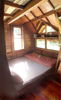 One of the beds in the treehouse